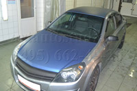 Opel Astra стайлинг крыши, капота, крышки багажника синей матовой плёнкой